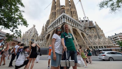 Tourists pose for selfies in front of the Sagrada Familia basilica in Barcelona on August 19, 2017, said to be the target of terrorists who resorted to ramming attacks after their plot was foiled. Lluis Gene / AFP