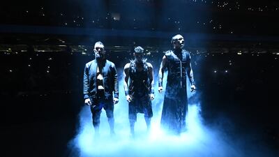 The Judgement Day with, from left, Finn Balor, Rhea Ripley and Damian Priest, make their entrance in the ring.