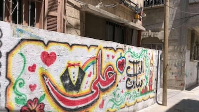 Neighbourhood graffiti in Gaza City expresses congratulations for the bridegroom Ali