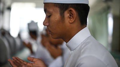 A Muslim student recites a prayer in Bentong, outside Kuala Lumpur. AFP