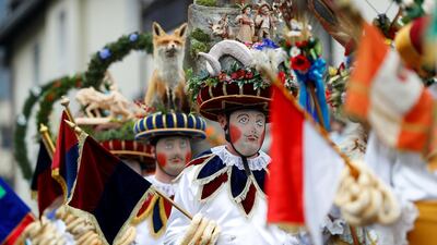 Participants dressed as Schleicher attend the traditional Schleicherlaufen run during Shrovetide (Fasnacht) in Telfs, Austria. REUTERS
