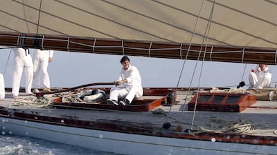 Spanish tennis player Rafael Nadal steers a Tuiga yacht on the sidelines of the Monte Carlo ATP Masters tennis tournament in Monaco on April 14, 2014. AFP PHOTO/POOL/ERIC GAILLARD