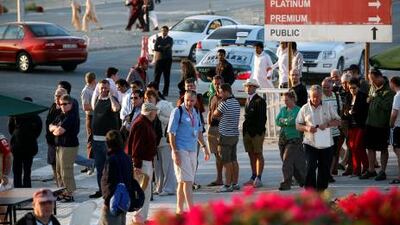 Cricket fans wait for the taxis outside the Dubai International Cricket Stadium.