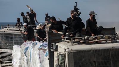 Aid lorries sent by the UN enter the Zakim border crossing in the north of Gaza city while under Israeli attacks on June 25.