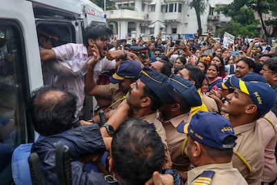 Indian police detain supporters of the Cockroach Janta Party in Mumbai on Monday. EPA