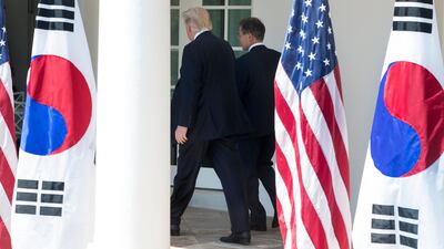 US president Donald Trump (L) and president of South Korea Moon Jae-in (R) walk down the Colonnade after delivering joint statements in the Rose Garden of the White House in Washington, DC, on June 30. EPA / Michael Reynolds