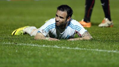 Marseille's Mathieu Valbuena reacts after missing a scoring opportunity against Rennes on Saturday. Jean-Paul Pelissier / Reuters / March 22, 2014