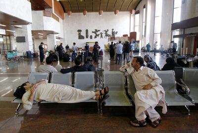 Passengers are seen at Basra airport after it was targeted by rocket fire. Reuters