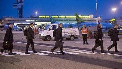 Members of the Disaster Identification Team (RIT) enter at a special plane bound for Libya at Rotterdam Airport this morning. Family members of the sole survivor of the crash were always on board.