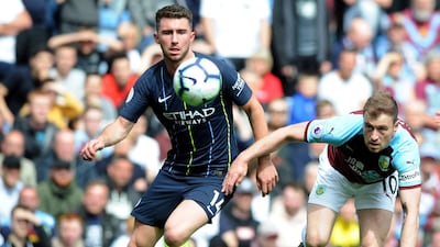 Aymeric Laporte duels for the ball with Burnley's Ashley Barnes. AP Photo