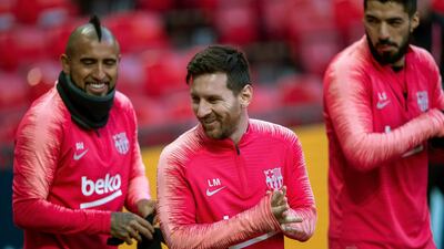 Barcelona's Lionel Messi, center, during the training session at Old Trafford, Manchester. AP