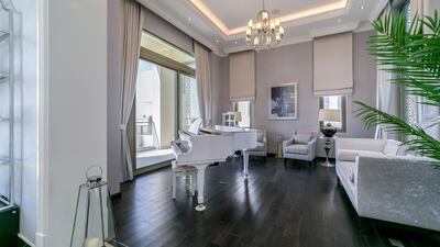 A beautiful white piano awaits. Courtesy LuxuryProperty.com