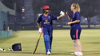 Katie Thompson, right, is the second English-born player to represent UAE in women's cricket