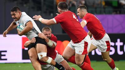 Fiji's hooker Samuel Matavesi (L) is tackled during the Japan 2019 Rugby World Cup Pool D match between Wales and Fiji at the Oita Stadium in Oita. AFP