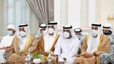Abdullah Saleh bin Badowah, left, and Faris Al Mazrouei Assistant Minister for Security and Military Affairs, second left, attend an Eid Al Adha reception at Mushrif Palace.