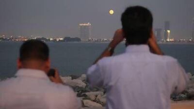Photographers flocked to the Palm Jumeirah to photograph last night's "supermoon" but many felt disappointed by what they saw. Lee Hoagland / The National