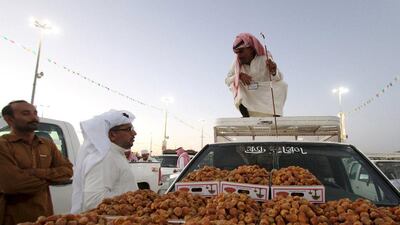 A vendor sells dates in Berida, in the Saudi central province of Qassim. Faisal Al Nasser / Reuters