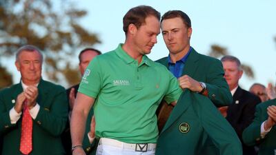 Jordan Spieth of the United States presents Danny Willett of England with the green jacket after Willett won the 2016 Masters Tournament at Augusta National Golf Club on April 10, 2016 in Augusta, Georgia. David Cannon/Getty Images/AFP