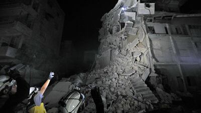 Members of the Syrian White Helmets search for victims after a building collapsed days after air strikes on the town of Ariha, in the south of Syria's Idlib province. AFP