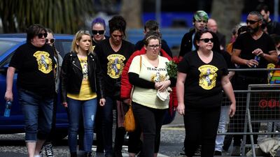 Mourners wearing Harry Potter themed shirts. Reuters
