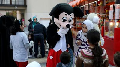 Mickey Mouse, Donald Duck, Garfield, Hello Kitty and other popular characters are on hand to greet visitors as they enter the park and to perform a dance with the children on stage. Sammy Dallal / The National