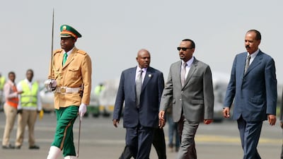 Eritrea's President Isaias Afwerki is welcomed by Ethiopian Prime Minister Abiy Ahmed upon arriving for a three-day visit, at the Bole international airport in Addis Ababa. Reuters