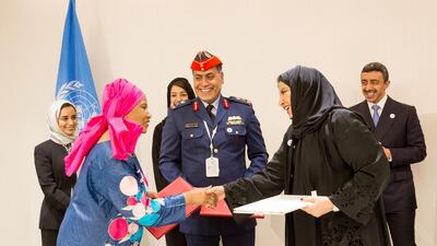 Phumzile Mlambo-Ngcuko, director of UN Women, Sheikh Abdullah bin Zayed, Minister of Foreign Affairs and International Co-operation, and Noura Al Suwaidi, director general of The General Women’s Union at the signing of an initiative in 2018 that will help build Arab women get into the military and peacekeeping forces. Credit: UN Women