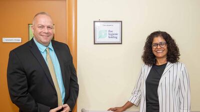 Mr Lafferty and the centre's director Ramjini Ramnath. The donation will cover all expenses including iPads, uniforms, books and wages for a team of four teachers