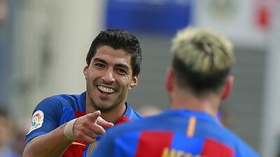 Luis Suarez, left, of Barcelona celebrates scoring. Gonzalo Arroyo Moreno / Getty Images)