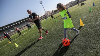 Irish coach Simon Baker, general secretary of the European Amputee Football Federation, provides a training session for Palestinian amputee children in Deir Al Balah stadium in the central Gaza Strip. EPA