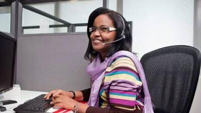 Leena Maghgobali, at work in Aramex's call centre, is a cancer survivor who secured her job through Pure Hearts 4 Cancer. Antonie Robertson / The National