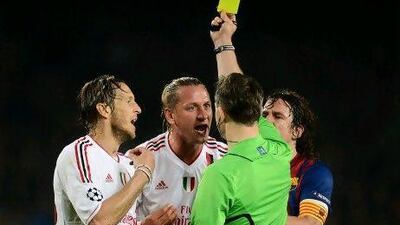 AC Milan's players were frustrated by decisions that went against them in Barcelona.