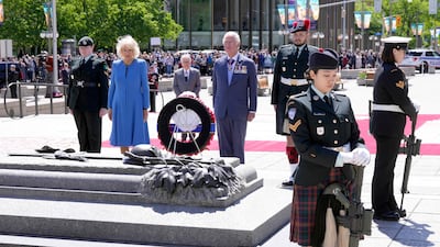 Britain's Prince Charles and Camilla, Duchess of Cornwall, lay a wreath at the National War Memorial in Ottawa on May 18, 2022. AFP