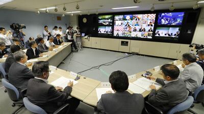 A teleconference is held at Hokkaido Government in Sapporo, northern Japan after North Korea fired a missile over Japan on Tuesday, August 29, 2017. Masanori Takei / Kyodo News via AP