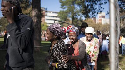 South African men and women arrive for a parade as thousands of people celebrate 20 years of democracy during a Freedom Day event held at the Union Buildings in Pretoria. Ihsaan Haffejee / EPA