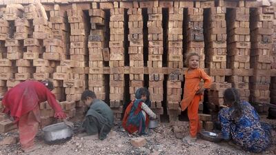 Afghan children working at a brick-making factory outside Kabul, Afghanistan on August 20, 2015. Mohammad Ismail / Reuters