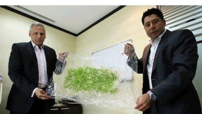 Yalman Khan, left, the chief executive of Agricel, and Kunal Wadhwani, a board member, show the technology in Dubai.