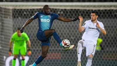 Vitoria de Guimaraes' Lucas Evangelista (R) fights for the ball with FC Porto's Moussa Marega. EPA
