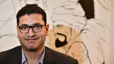 Egyptian writer Mumen Hilmi poses in his office in Sharjah. He has given renowned 6th century Arab poet Antara a new identity in the comic world AFP