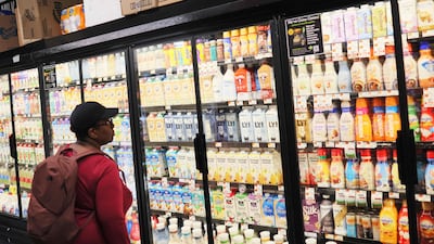 A shopper keeps an eye on food prices at a New York supermarket. AFP