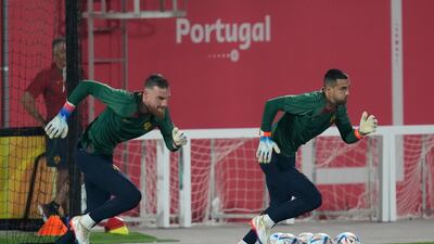 Portugal's goalkeepers Diogo Costa, right, and Jose Sa, left, warm up. AP