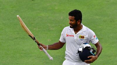 Dimuth Karunaratne of Sri Lanka leaves the field after being dismissed by Wahab Riaz of Pakistan during the second day of the second Test in Dubai. Giuseppe Cacace / AFP