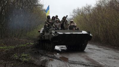 Ukrainian soldiers on an armoured personnel carrier, near the front line with Russian troops, in Izyum district, Kharkiv region, north-eastern Ukraine. AFP