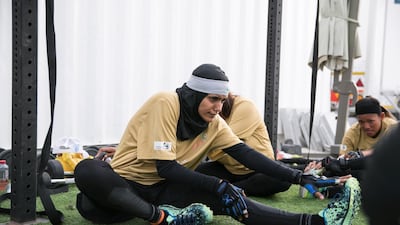 Female government employees warm up before the Dubai Government Games held at Kite Beach, Dubai on May 12, 2018. Reem Mohammed / The National