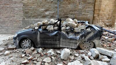 A damaged car sits in the “red zone” of Camerina, Italy, on October 28, 2016, where 80 per cent of the houses have been left uninhabitable after two powerful earthquakes hit the region a few days earlier. Thousands were forced to flee but “miraculously” no one was killed. Italy’s national geophysics institute has recorded almost 700 tremors, with experts saying they could go on for weeks or months. Alberto Pizzoli / Agence France-Presse