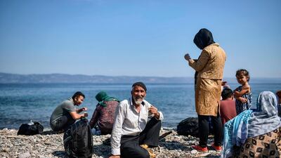 Migrants from Afghanistan arrive after crossing the Aegean Sea from Turkey with a dinghy on the Greek Mediterranean island of Lesbos on August 6, 2018. AFP