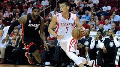 Houston Rockets' Jeremy Lin tries to drive past Miami Heat's LeBron James