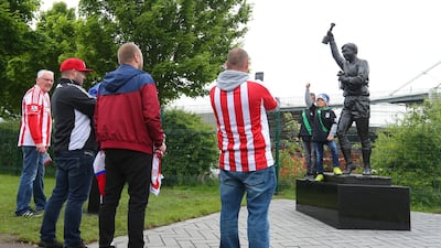 Fans look at the new statue of former Stoke City and England goalkeeper Gordon Banks outside Stoke City's ground in 2015. Getty Images