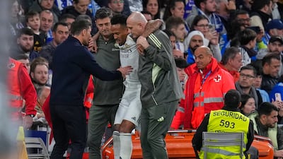 Real Madrid coach Xabi Alonso checks on Eder Militao who picked up an injury that will rule him out for three months. AP