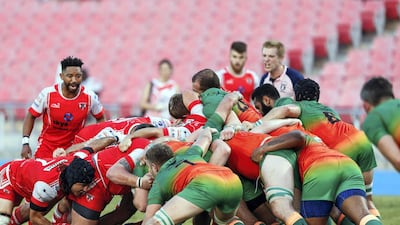 Dubai Knights Eagles take on Dubai Tigers, in red, in the West Asia Premiership at Dubai Sports City on Friday. The Tigers won 27-16.